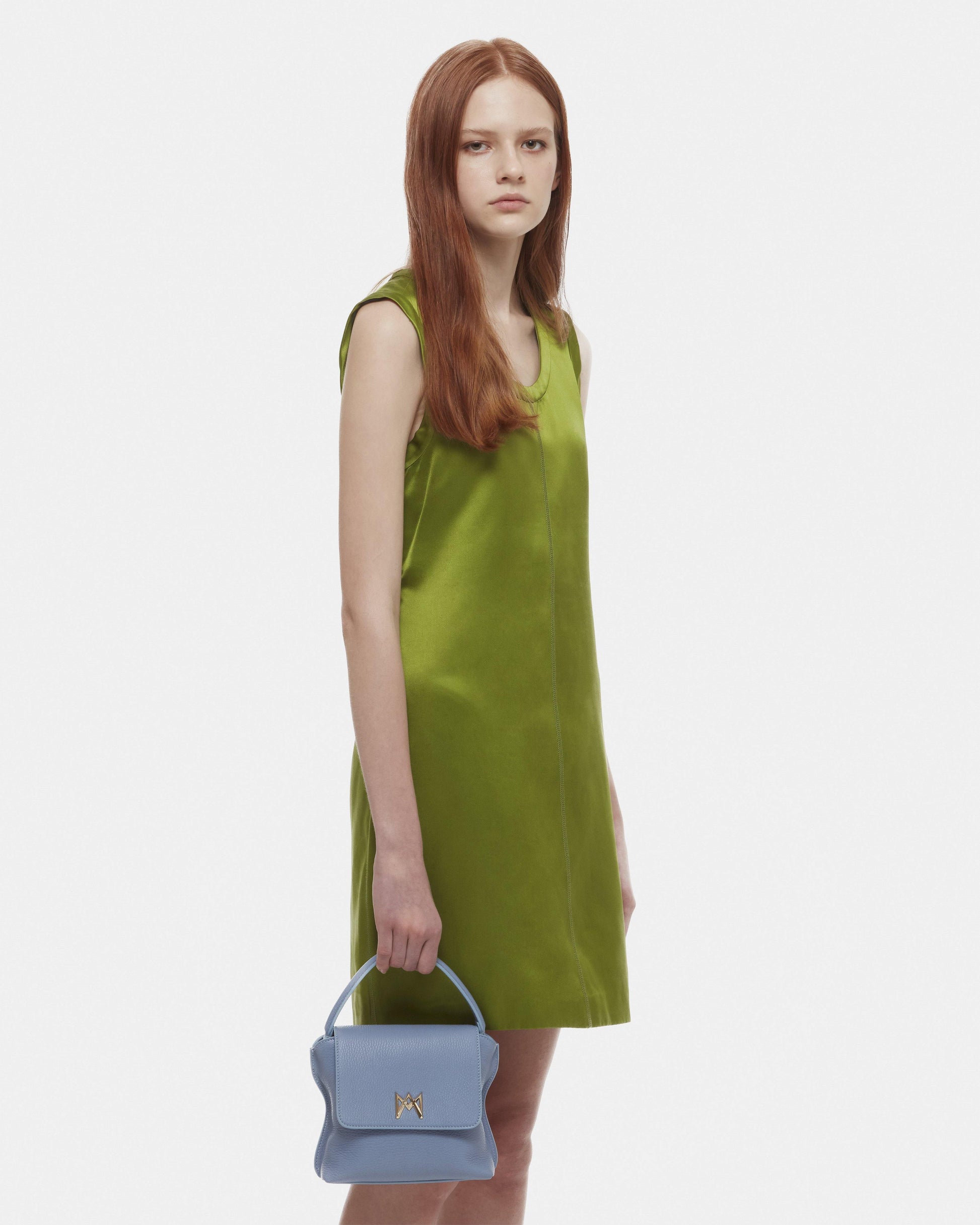 Cross-body bag in Italian full-grain leather, semi-aniline calf Italian leather with detachable shoulder strap.Three compartments, zip pocket in the back compartment. Magnetic flap closure with logo. Color: Baby Blue. Size:Medium
