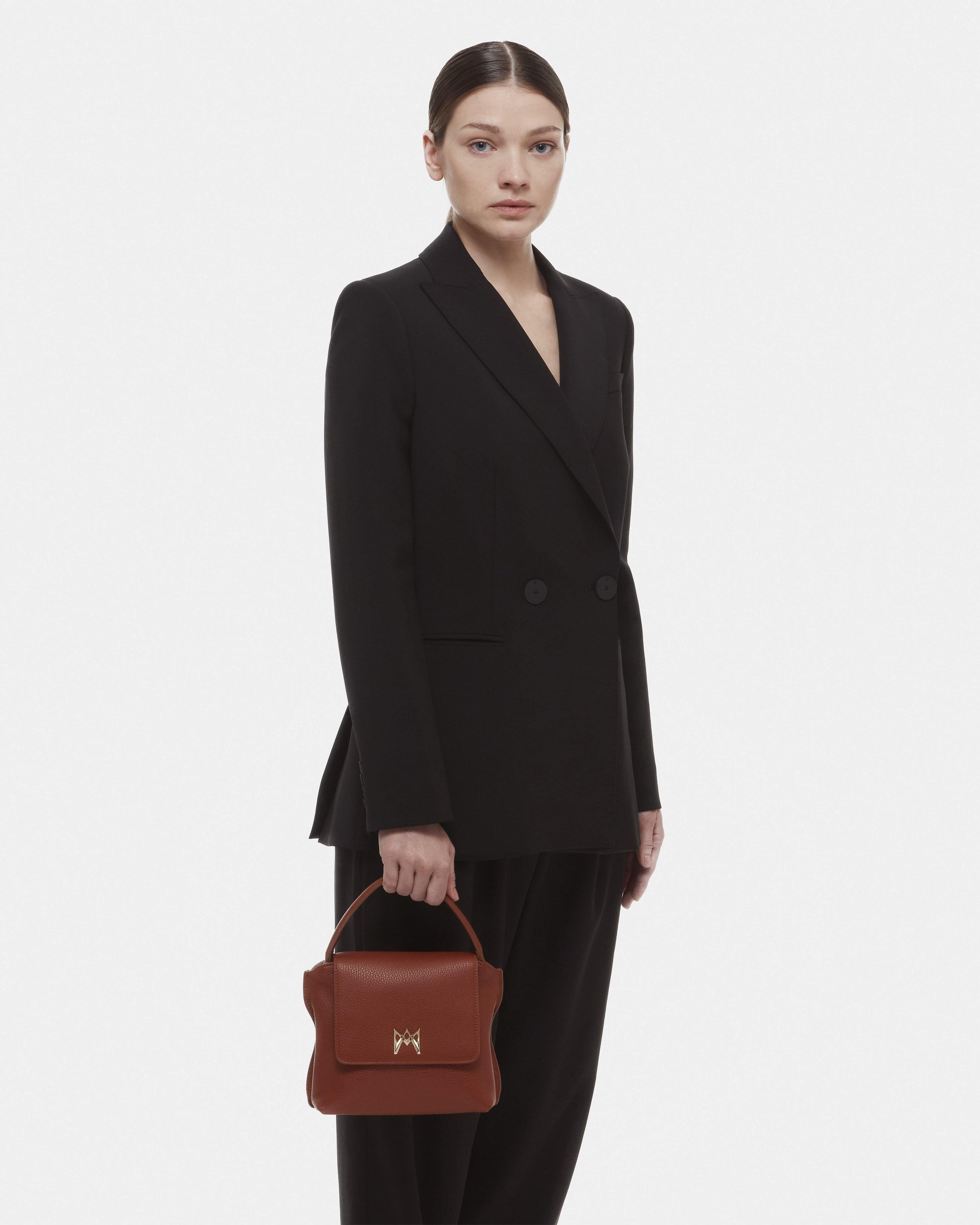 Cross-body bag in Italian full-grain leather, semi-aniline calf Italian leather with detachable shoulder strap.Three compartments, zip pocket in the back compartment. Magnetic flap closure with logo. Color: Brown. Size:Medium