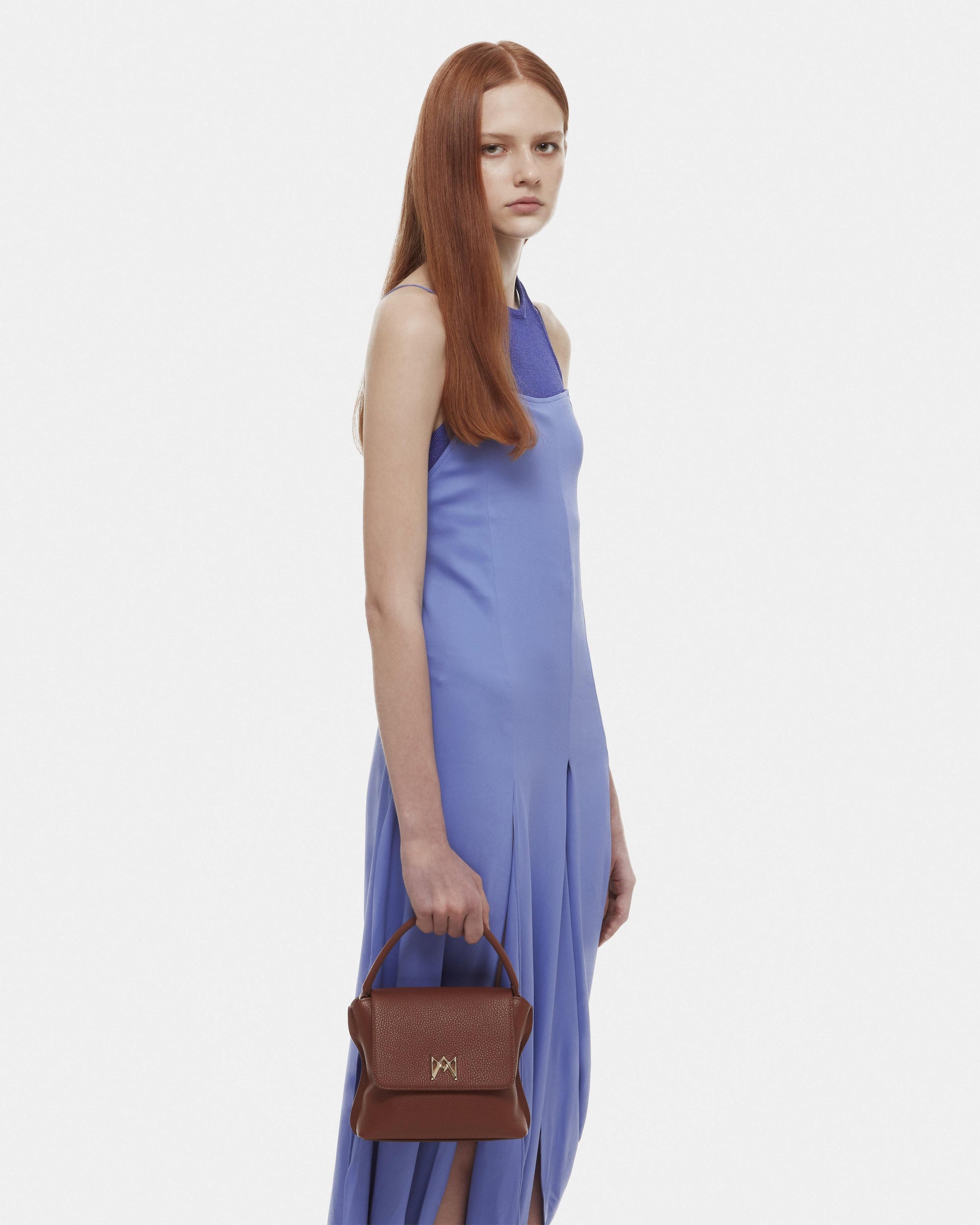 Cross-body bag in Italian full-grain leather, semi-aniline calf Italian leather with detachable shoulder strap.Three compartments, zip pocket in the back compartment. Magnetic flap closure with logo. Color: Dark Brown. Size: Medium.