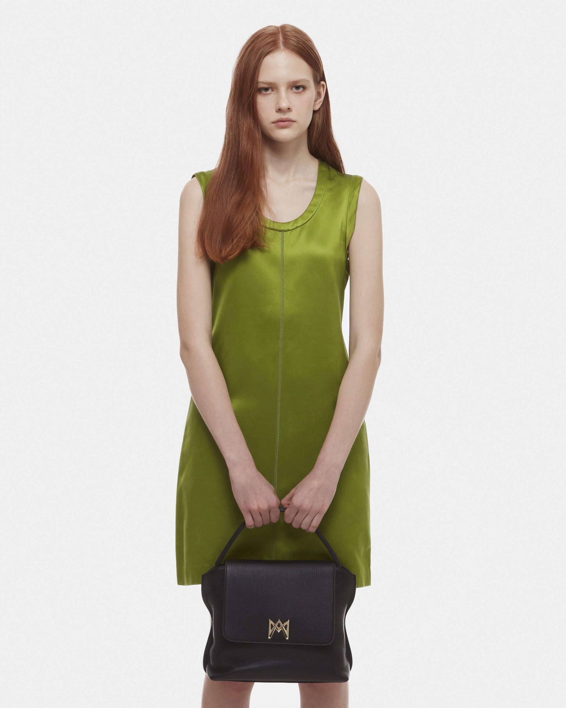 Cross-body bag in Italian full-grain leather, semi-aniline calf Italian leather with detachable shoulder strap.Three compartments, zip pocket in the back compartment. Magnetic flap closure with logo. Color: Black. Size:Large
