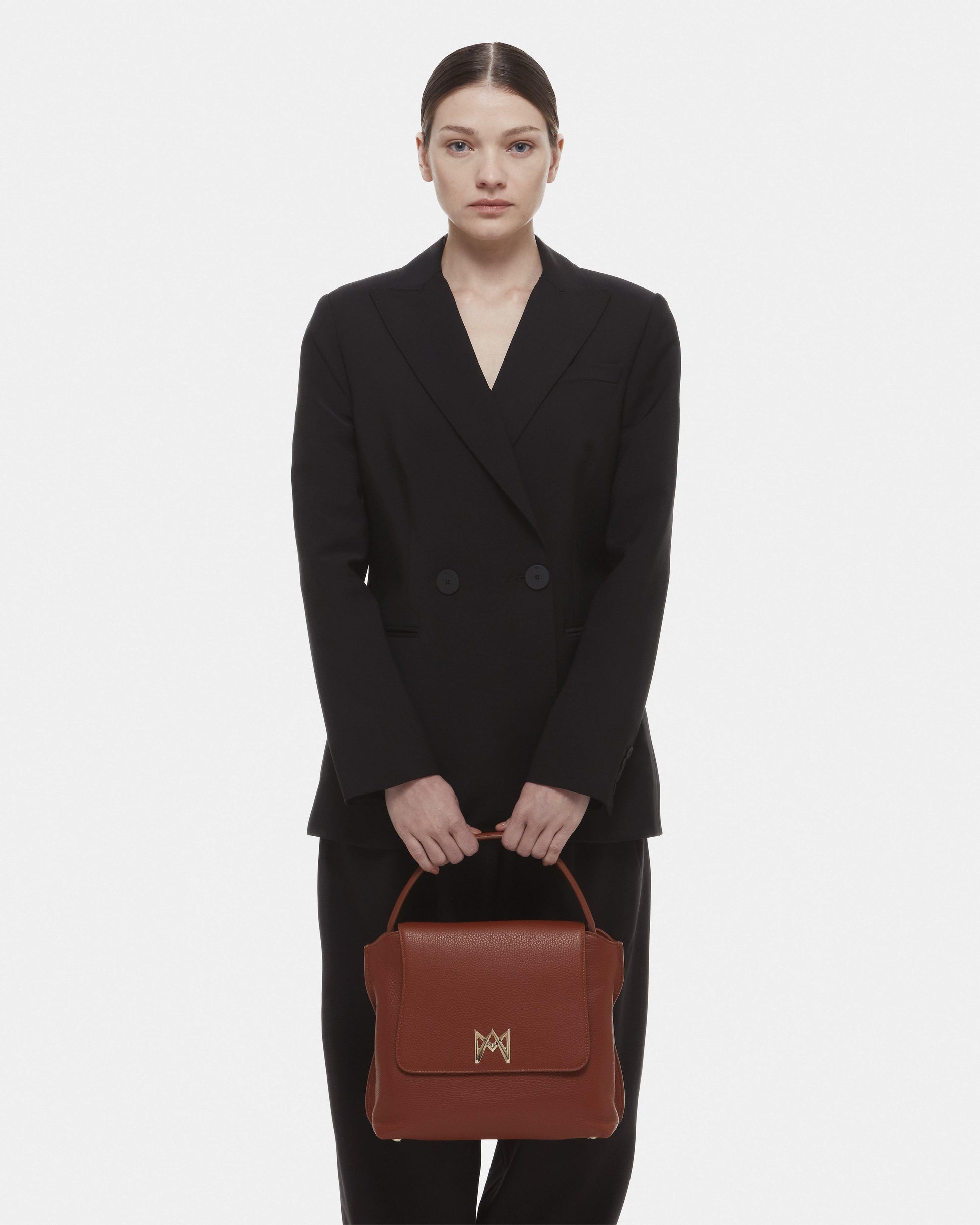 Cross-body bag in Italian full-grain leather, semi-aniline calf Italian leather with detachable shoulder strap.Three compartments, zip pocket in the back compartment. Magnetic flap closure with logo. Color: Brown. Size:Large