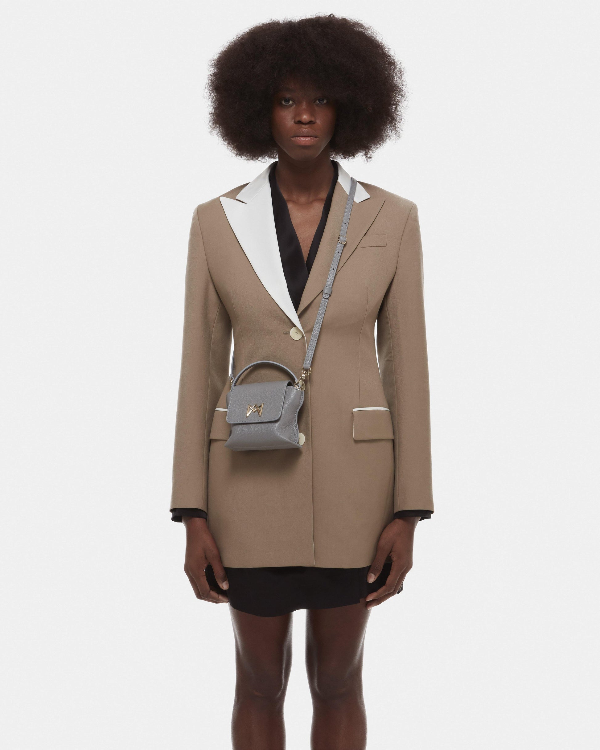Cross-body bag in Italian full-grain leather, semi-aniline calf Italian leather with detachable shoulder strap.Three compartments, zip pocket in the back compartment. Magnetic flap closure with logo. Color: Gray. Size: Mini.