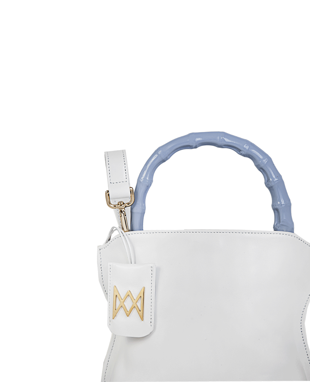 Cross-body bag in calf leather with detachable shoulder strap. Bamboo handles. Made In Italy. Two compartments, zip pocket in the back compartment. Magnetic flap closure with logo. Color: Ivory. Size: Medium